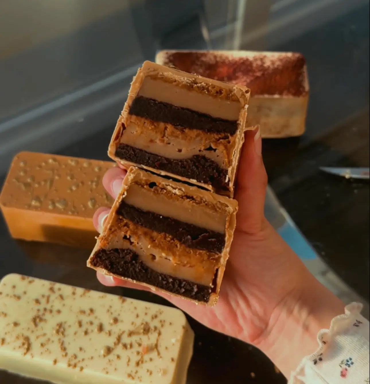 Tiramisu Patisserie Bar made by GoldBites on a background with other patisserie bars